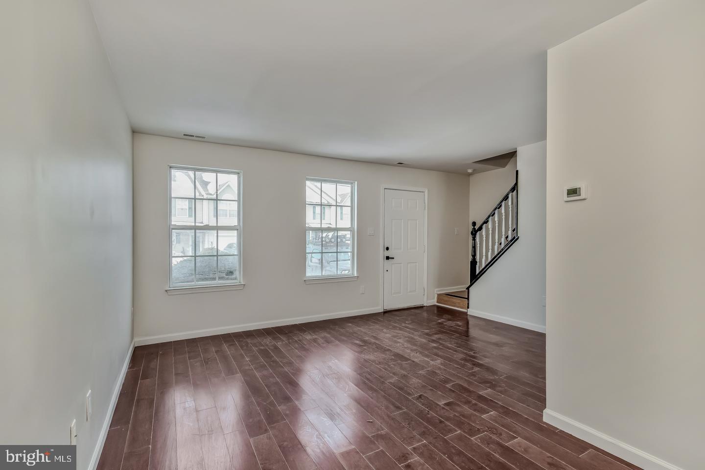 2704 Tall Pines Pine Hill, NJ 08021 - Photo 2 of 21 an empty room with wooden floor and windows
