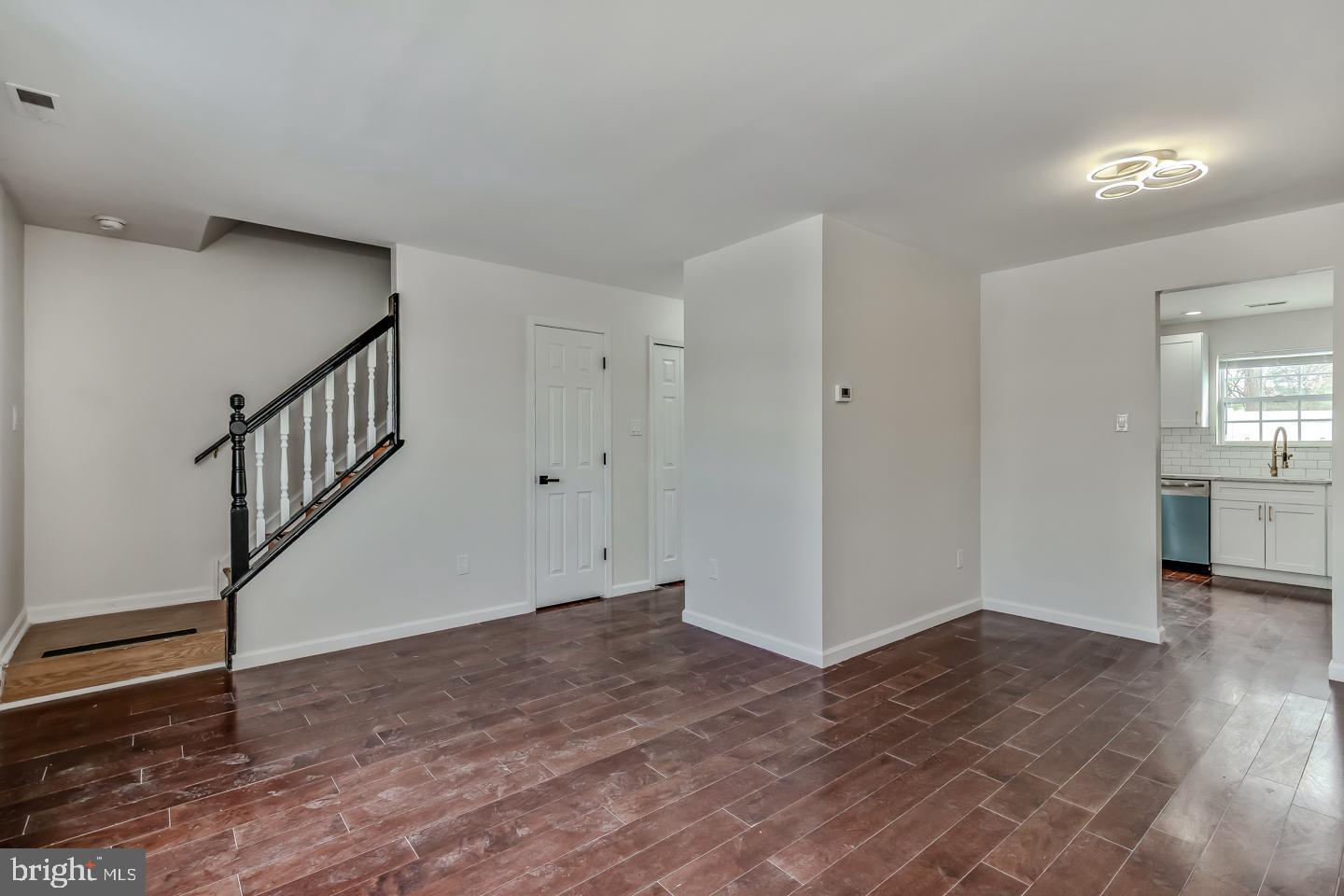 2704 Tall Pines Pine Hill, NJ 08021 - Photo 3 of 21 a view of an empty room with wooden floor and stairs