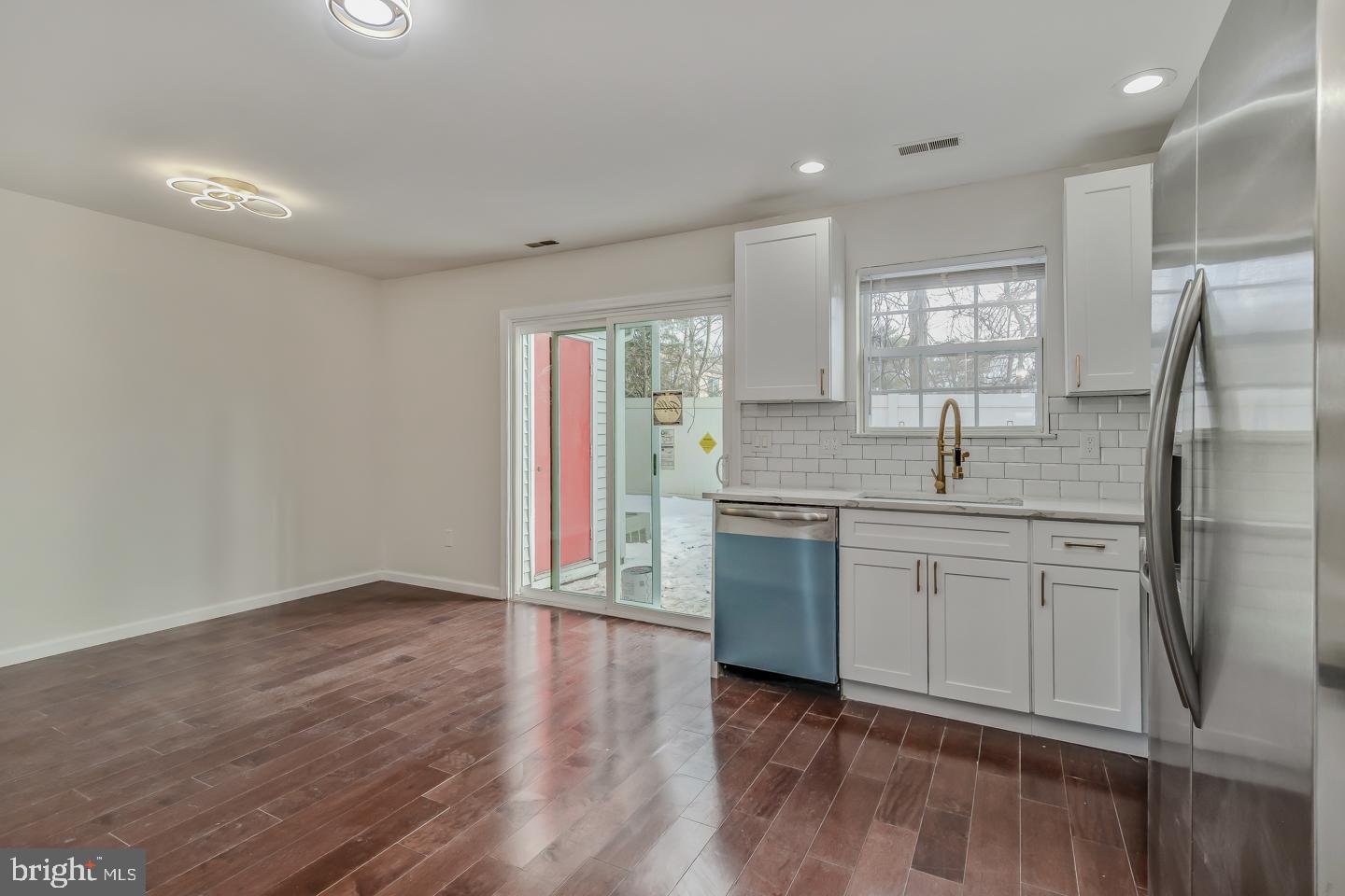 2704 Tall Pines Pine Hill, NJ 08021 - Photo 5 of 21 a kitchen with stainless steel appliances granite countertop a refrigerator and a sink