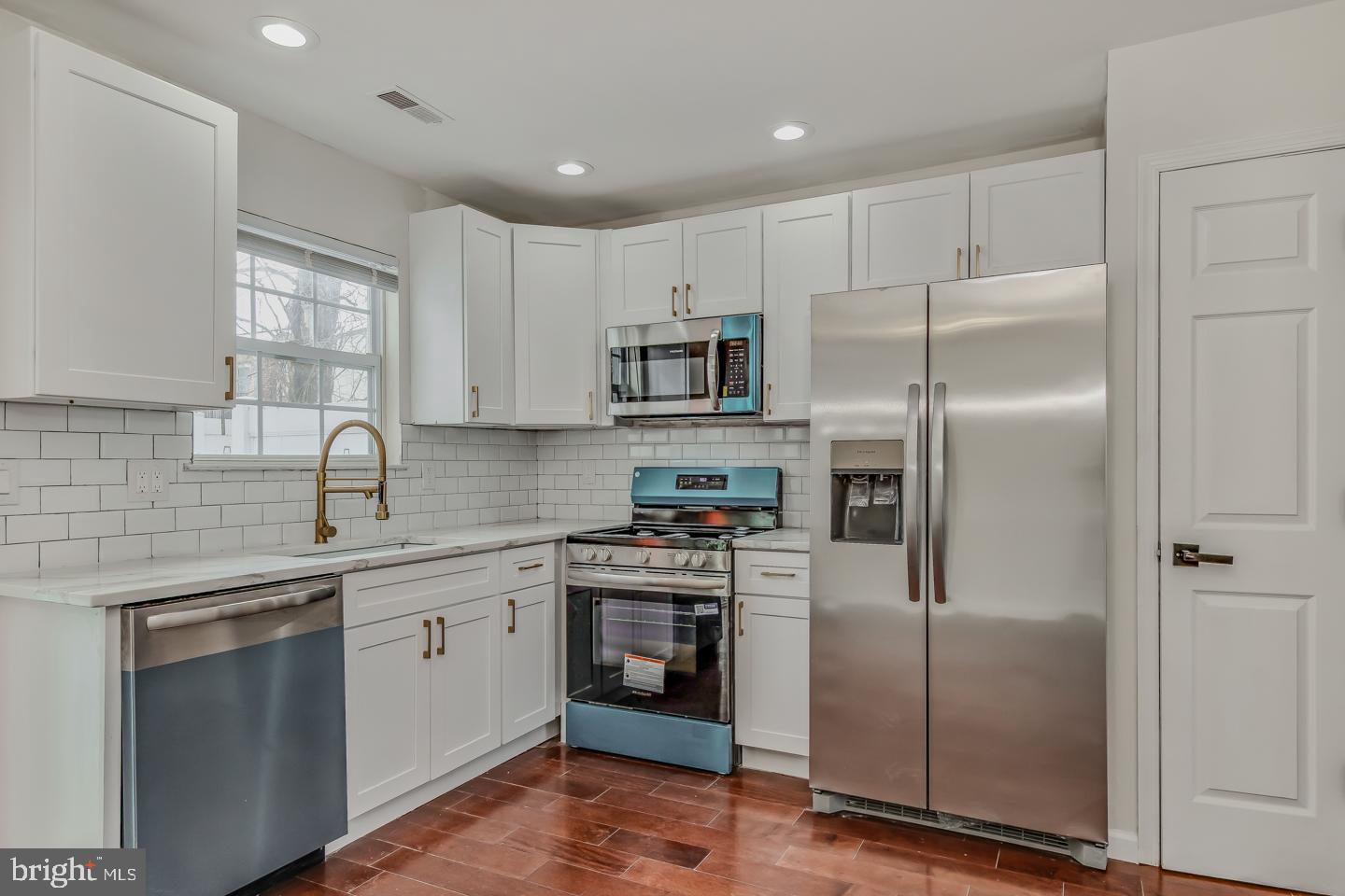2704 Tall Pines Pine Hill, NJ 08021 - Photo 6 of 21 a kitchen with a refrigerator sink and microwave