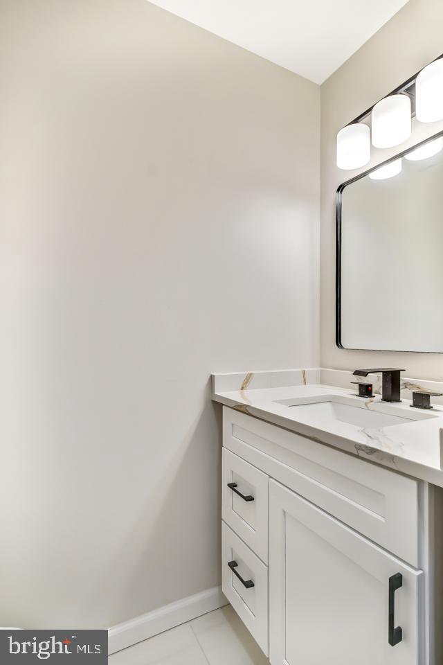 2704 Tall Pines Pine Hill, NJ 08021 - Photo 10 of 21 a bathroom with a granite countertop sink and a mirror