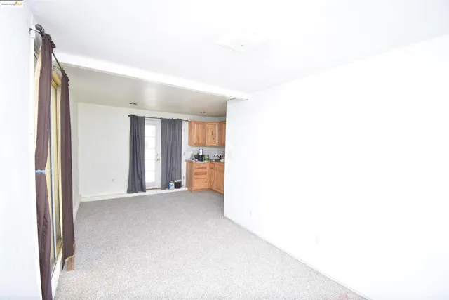 a view of a big room with closet and a bathroom