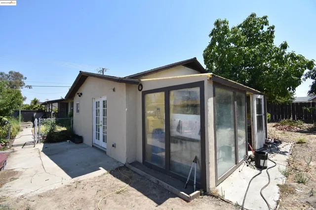 a backyard of a house with seating space