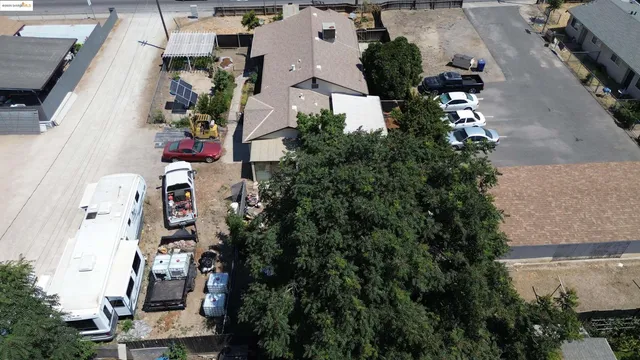 an aerial view of houses with outdoor space