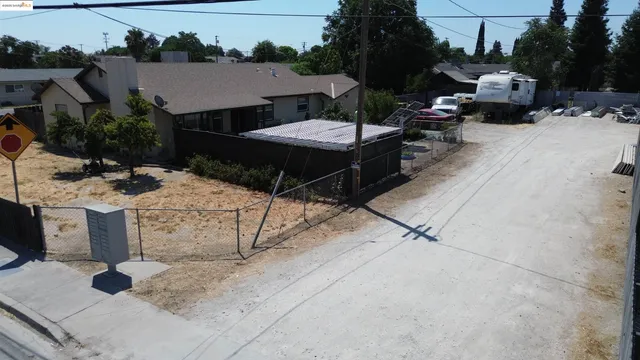 a view of backyard with sitting area
