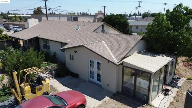 a aerial view of a house with a table and chairs