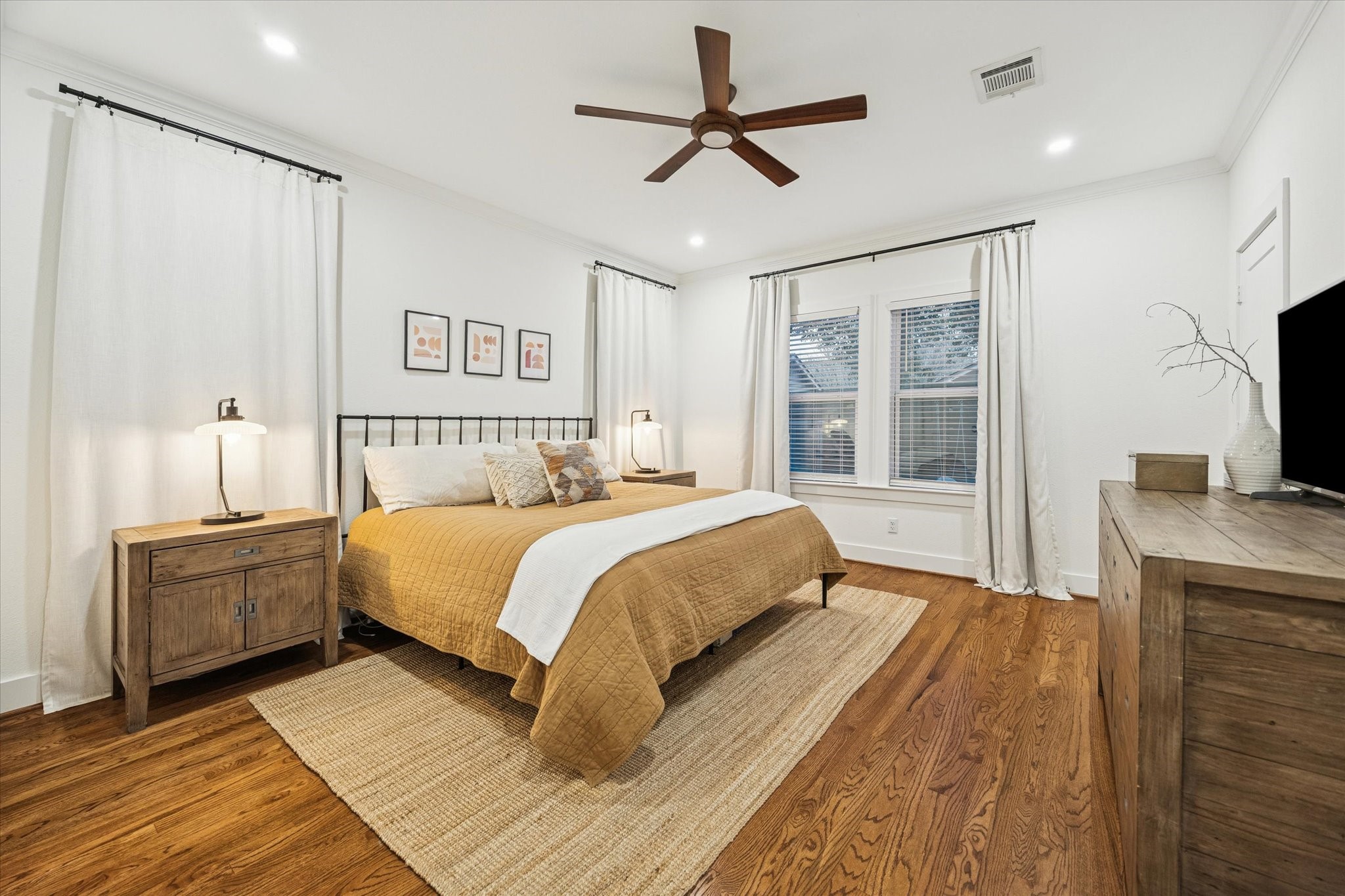 1135 Walling Street Houston, TX 77009 - Photo 13 of 32 primary bedroom, large 10x9 walk in closet not seen in photo, new fans, LED lighting. oak wood floors.