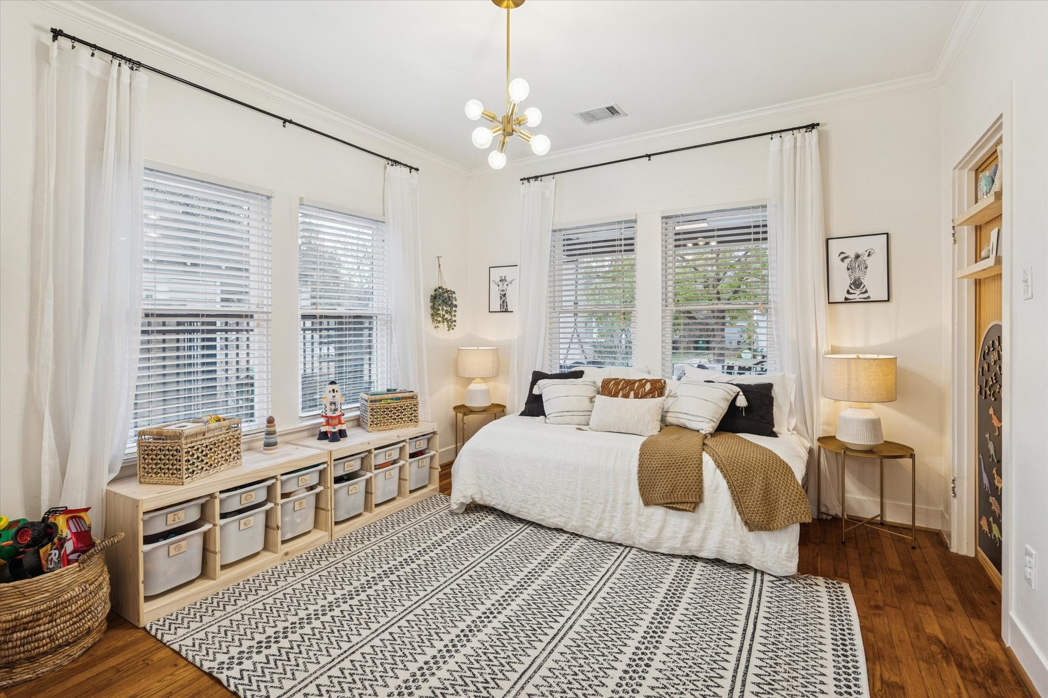 1135 Walling Street Houston, TX 77009 - Photo 17 of 32 2nd front bedroom is 12x11, tall and wide windows, updated lighting, large closet not seen in photo, doorway cutout to right is where previous door opening was before renovation.