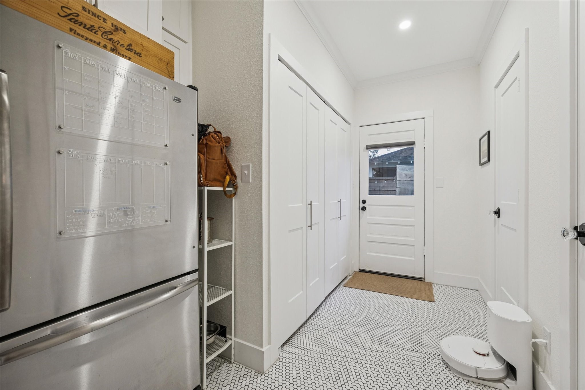 1135 Walling Street Houston, TX 77009 - Photo 20 of 32 8x10 utility/mudroom, thoughtful placement, ample storage, powder bath & exit to courtyard. Secondary fridge can be included with home.