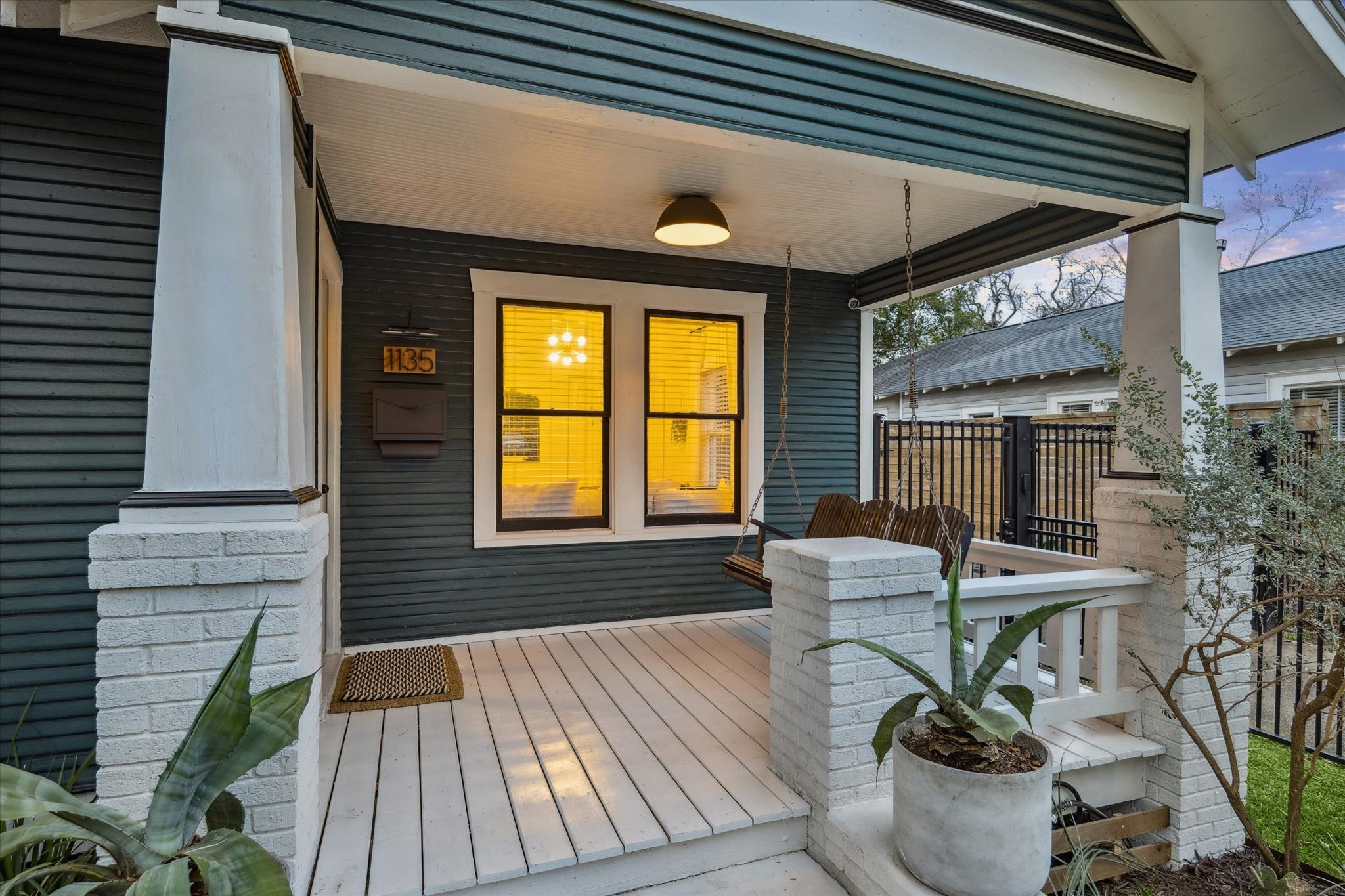 1135 Walling Street Houston, TX 77009 - Photo 2 of 32 large front covered patio, restored/replaced in 2024. porch swing.