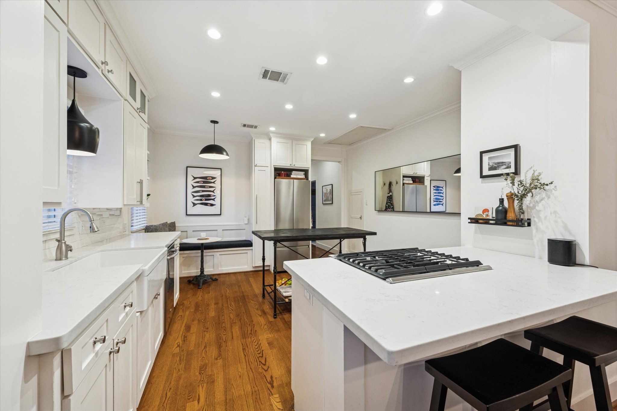 1135 Walling Street Houston, TX 77009 - Photo 9 of 32 quartz countertops, gas range with downdraft, farmhouse sink, timeless aesthetics. Fridge can be included with home.