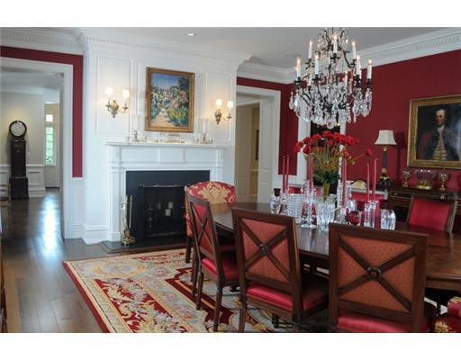 Undisclosed Address Greenwich, CT 06831 - Photo 5 of 10 a living room with a fireplace a chandelier and pool view