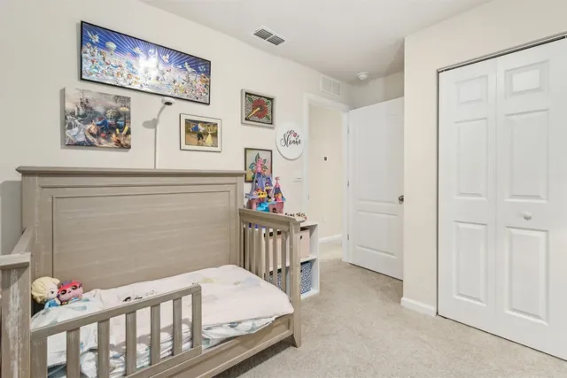 a bedroom with a bed and a table in it