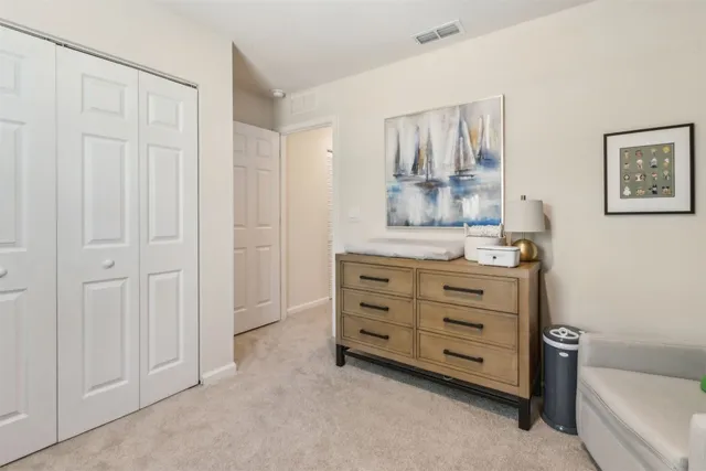 a view of room with cabinet and mirror