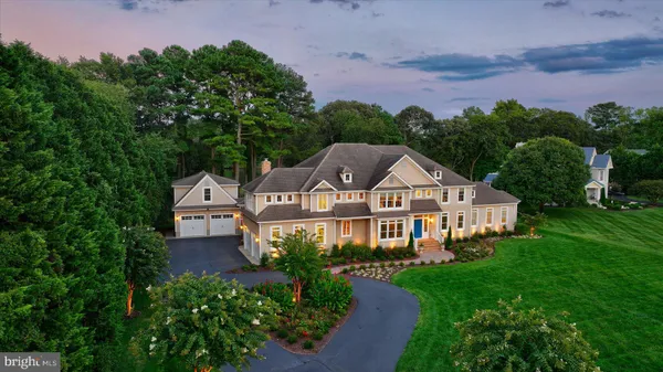 an aerial view of a house with garden space and street view