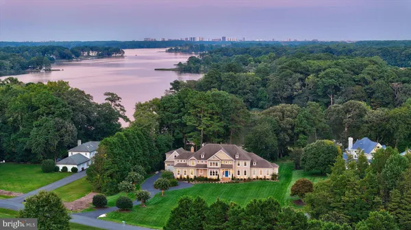an aerial view of residential house with outdoor space and swimming pool