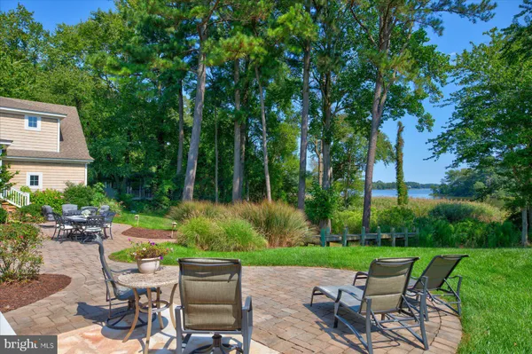 a view of a dining room with furniture and windows