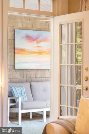 a bedroom with a bed and a flat tv screen on dresser