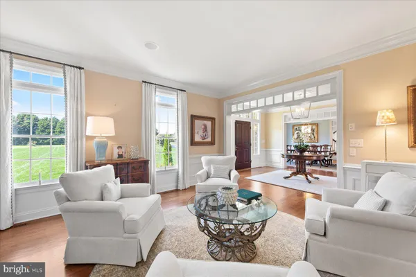 a view of a livingroom with workspace and a window
