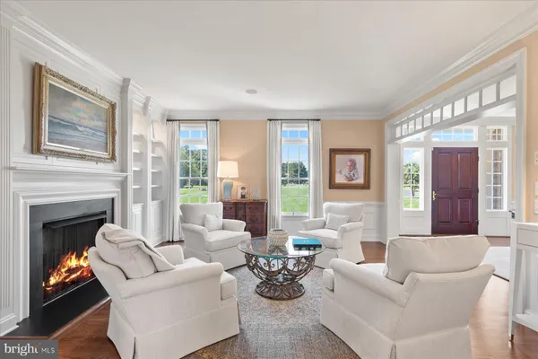 a bathroom with a glass shower door and a window