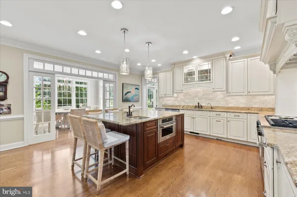 a living room with furniture a table and a large window