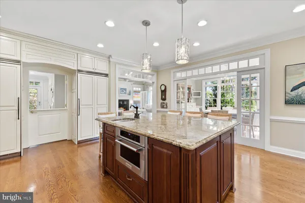 a living room with furniture a flat screen tv and a large window