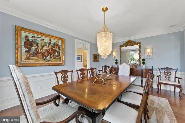 an aerial view of a house with a yard and outdoor seating