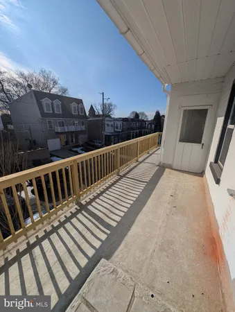 a view of balcony with furniture