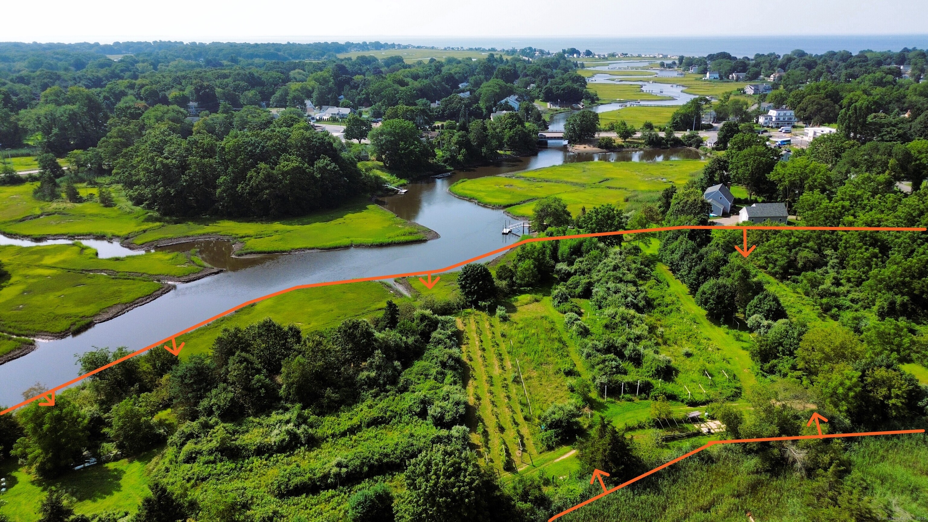an aerial view of a houses with a yard
