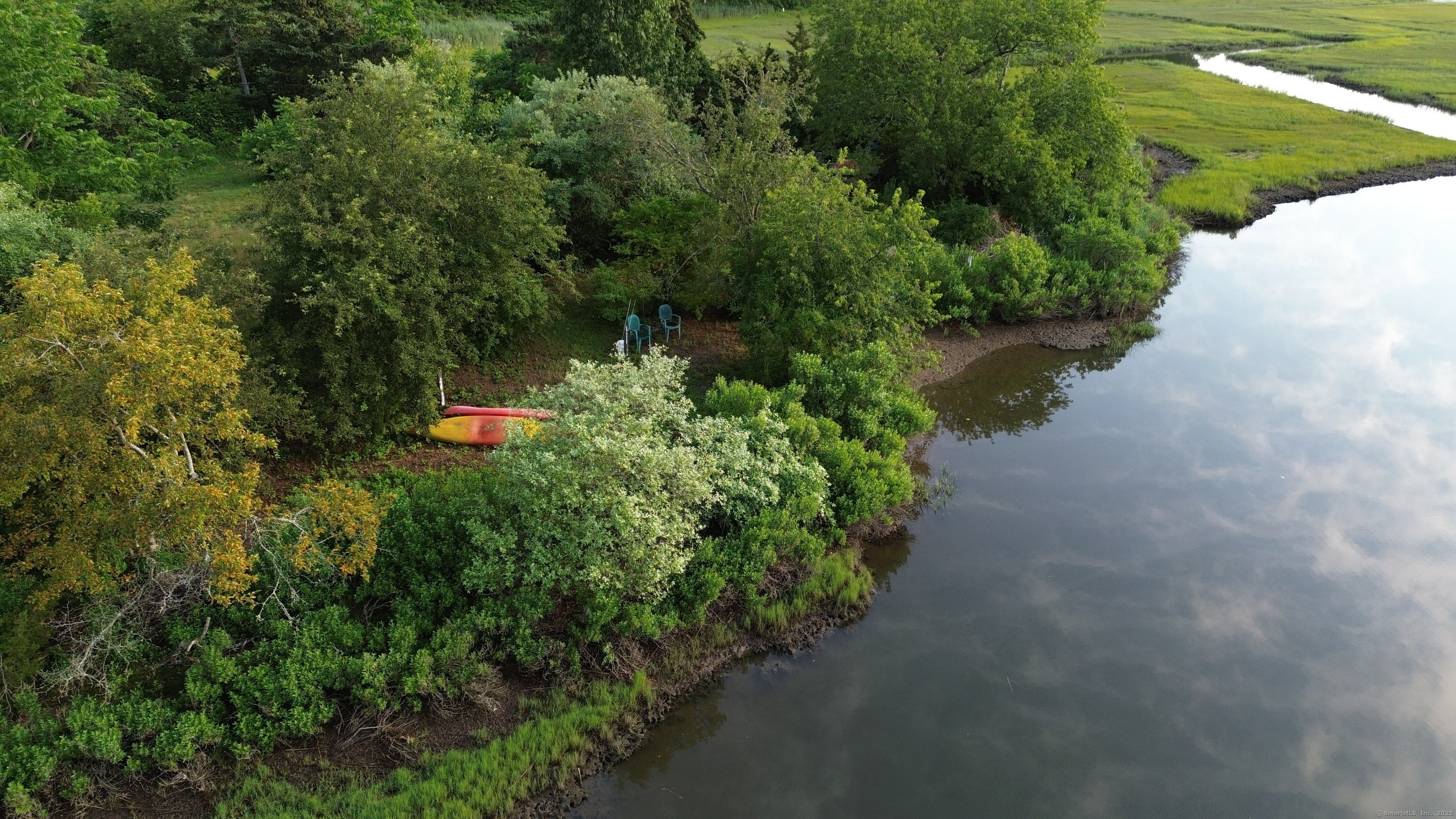 60 Ingham Hill Road Old Saybrook, CT 06475 - Photo 14 of 23 a view of a garden with a pond