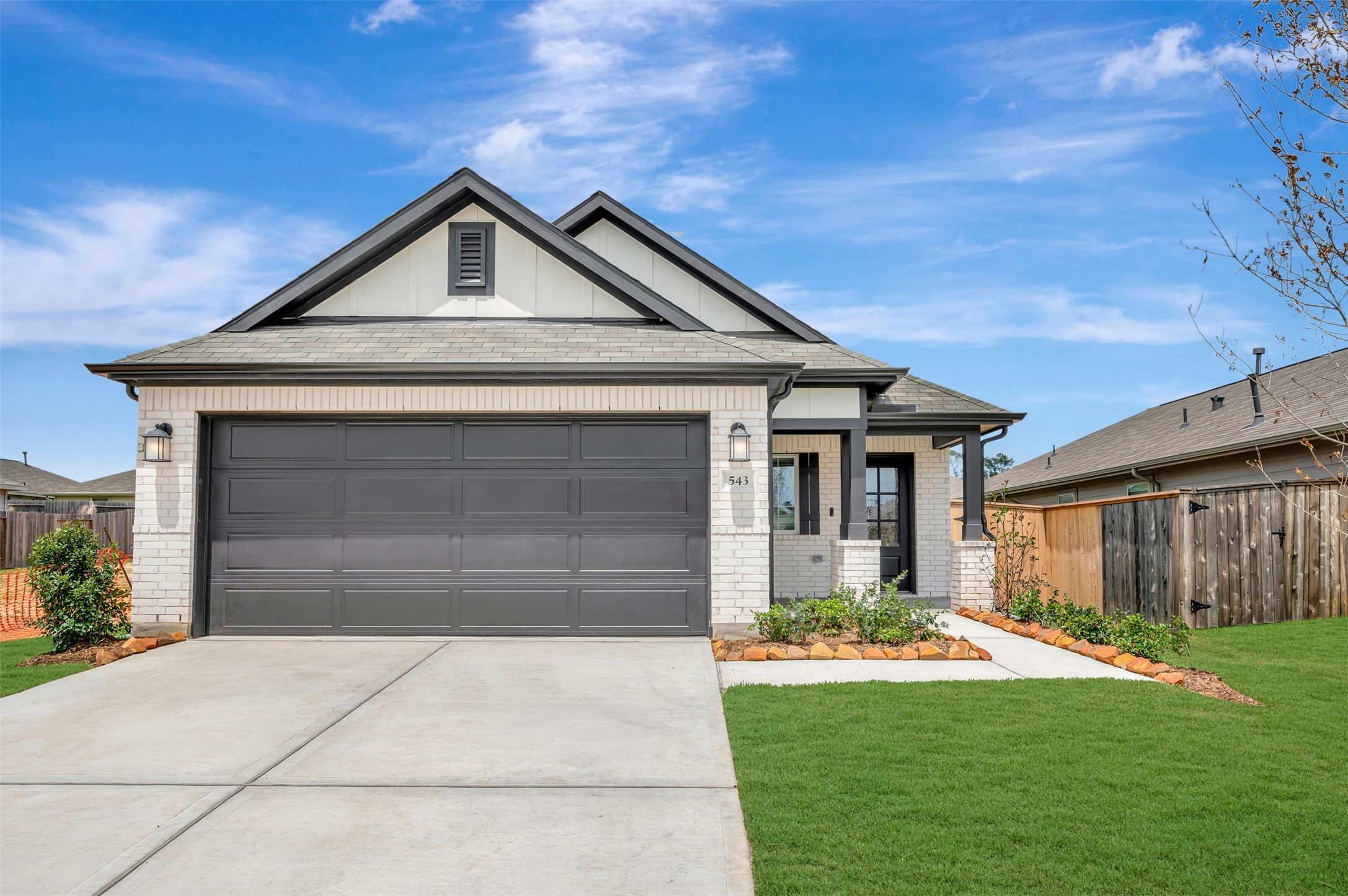 543 Flower Reed Court Magnolia, TX 77354 - Photo 11 of 46 a front view of house with yard and green space