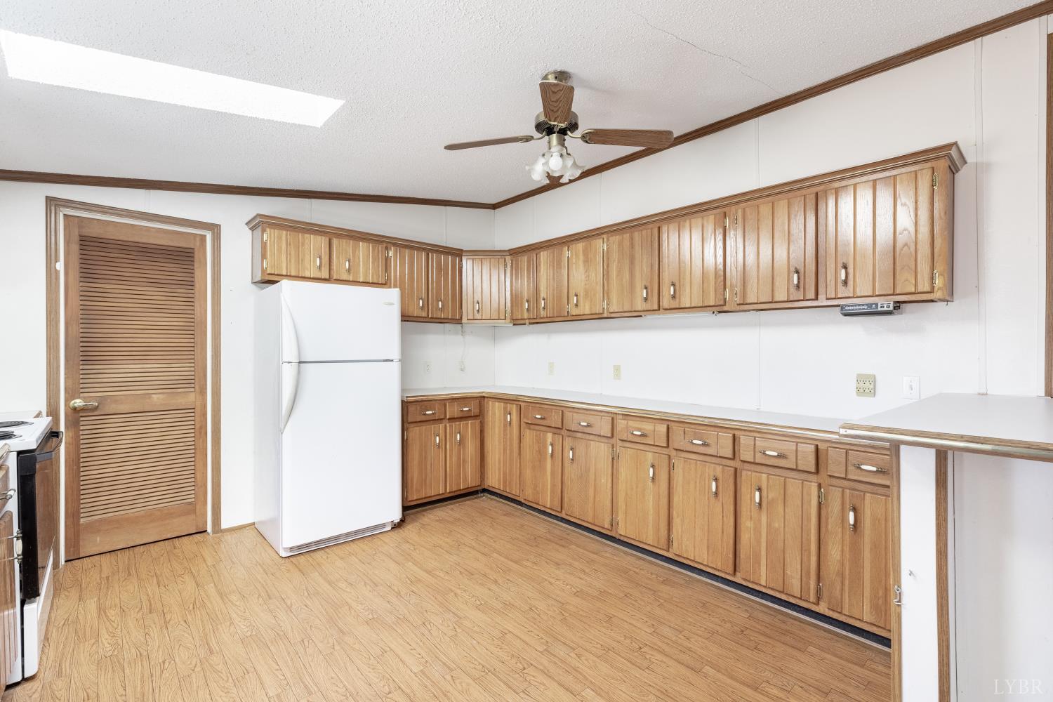 750 Price Lane Pamplin, VA 23958 - Photo 13 of 59 a kitchen with cabinets a refrigerator and a sink