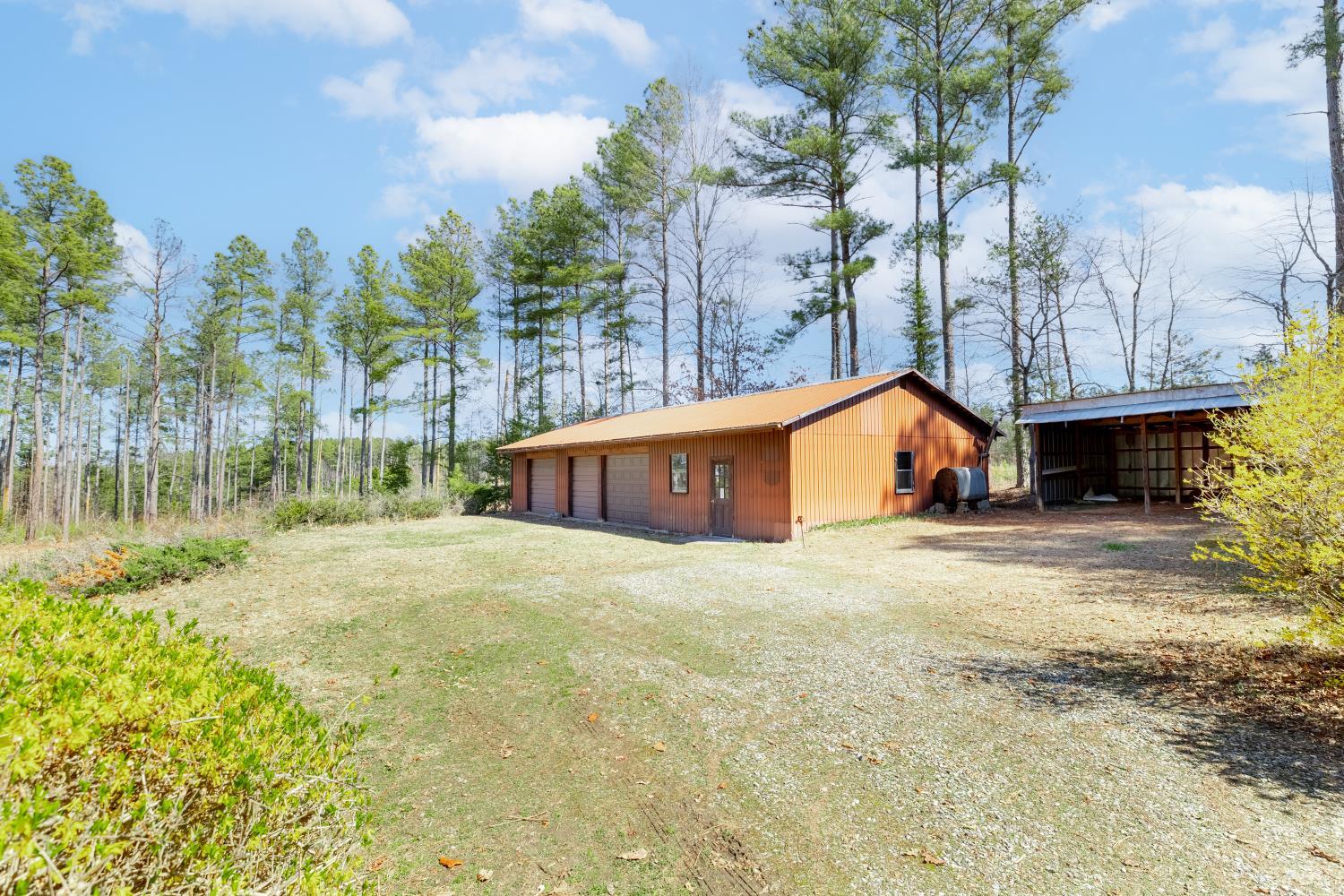 750 Price Lane Pamplin, VA 23958 - Photo 31 of 59 a front view of a house with a yard and garage