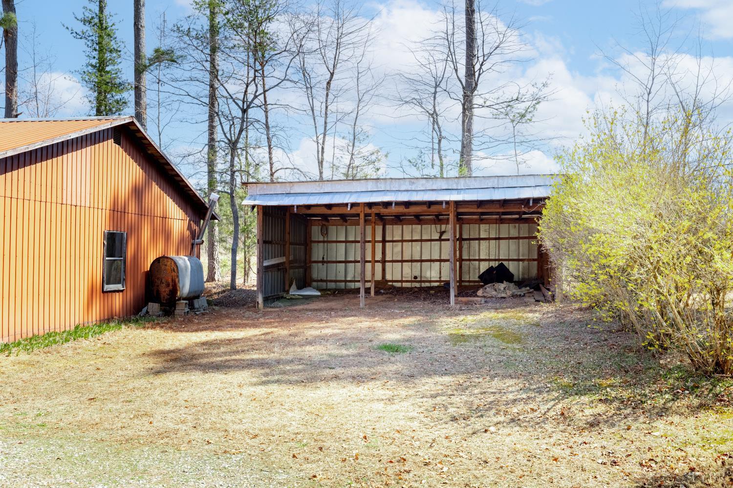 750 Price Lane Pamplin, VA 23958 - Photo 32 of 59 a front view of a house with a yard and garage