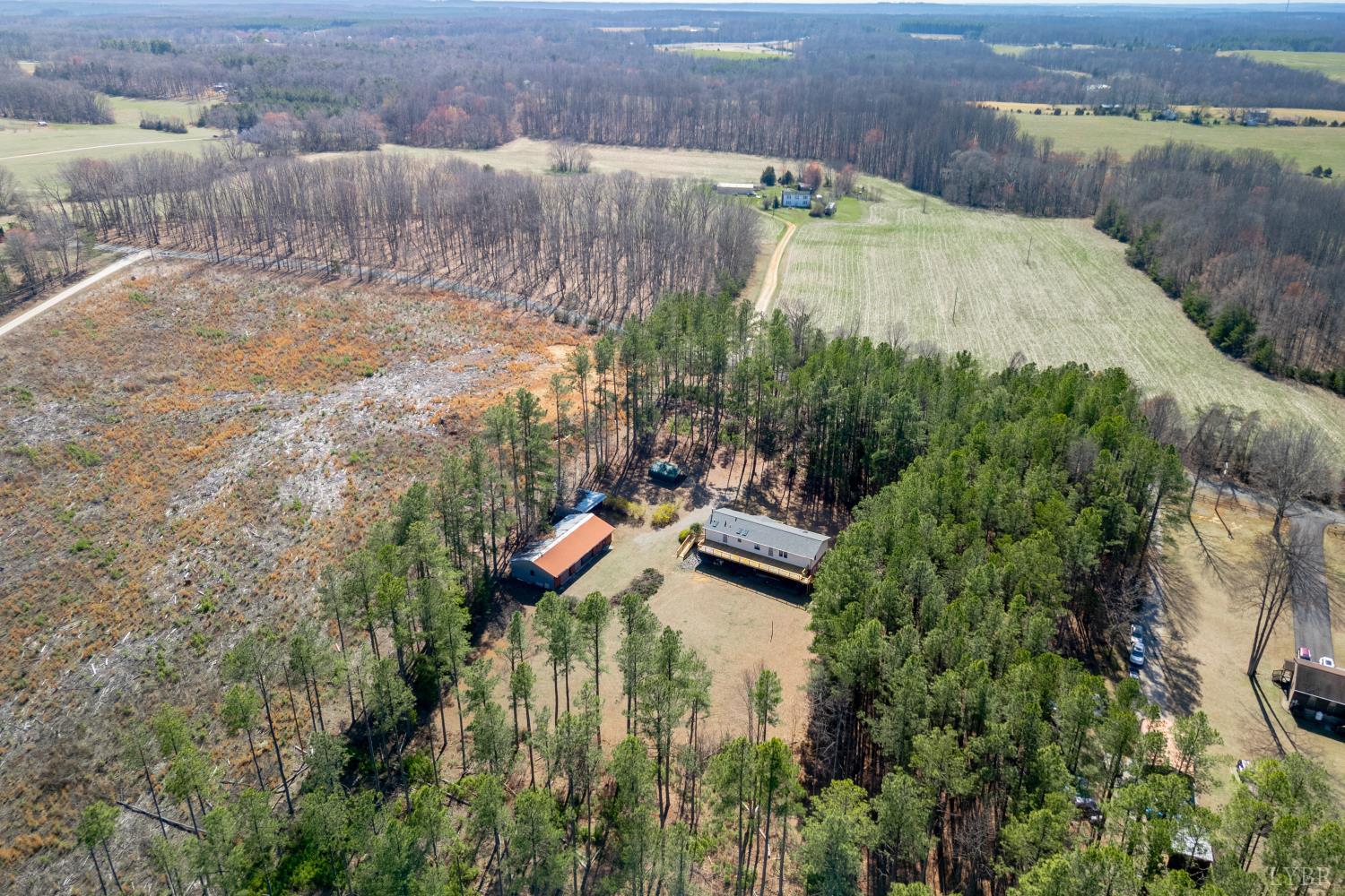 750 Price Lane Pamplin, VA 23958 - Photo 50 of 59 an aerial view of a house with a yard and lake view