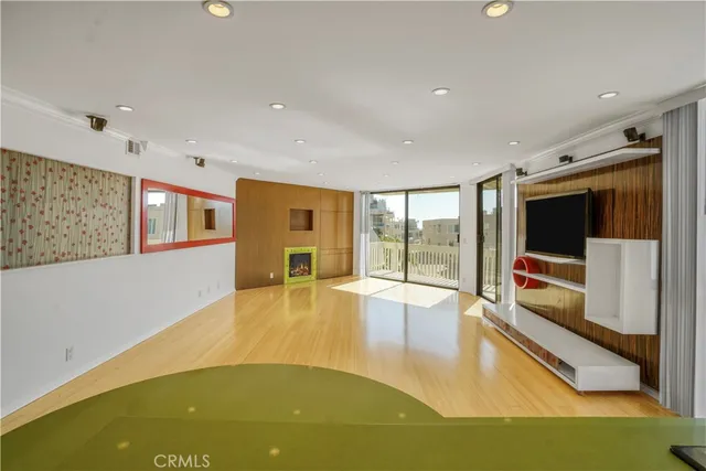 a swimming pool with yard from inside the house