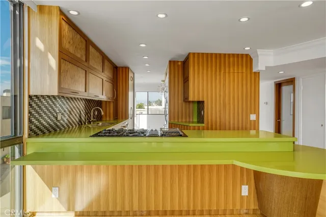 a view of a room with a bed and a window