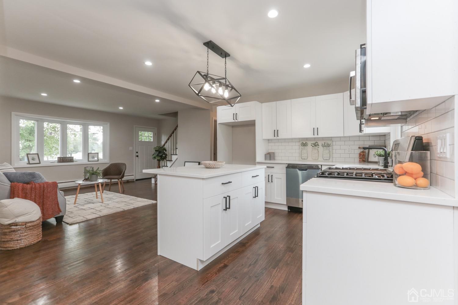 a kitchen with stove and cabinets