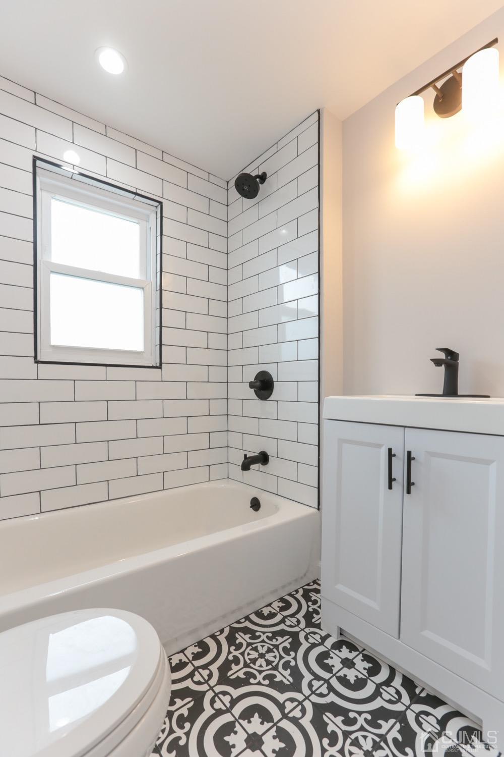 50 Hillcrest Road Colonia, NJ 07067 - Photo 14 of 24 a bathroom with a bathtub and a shower