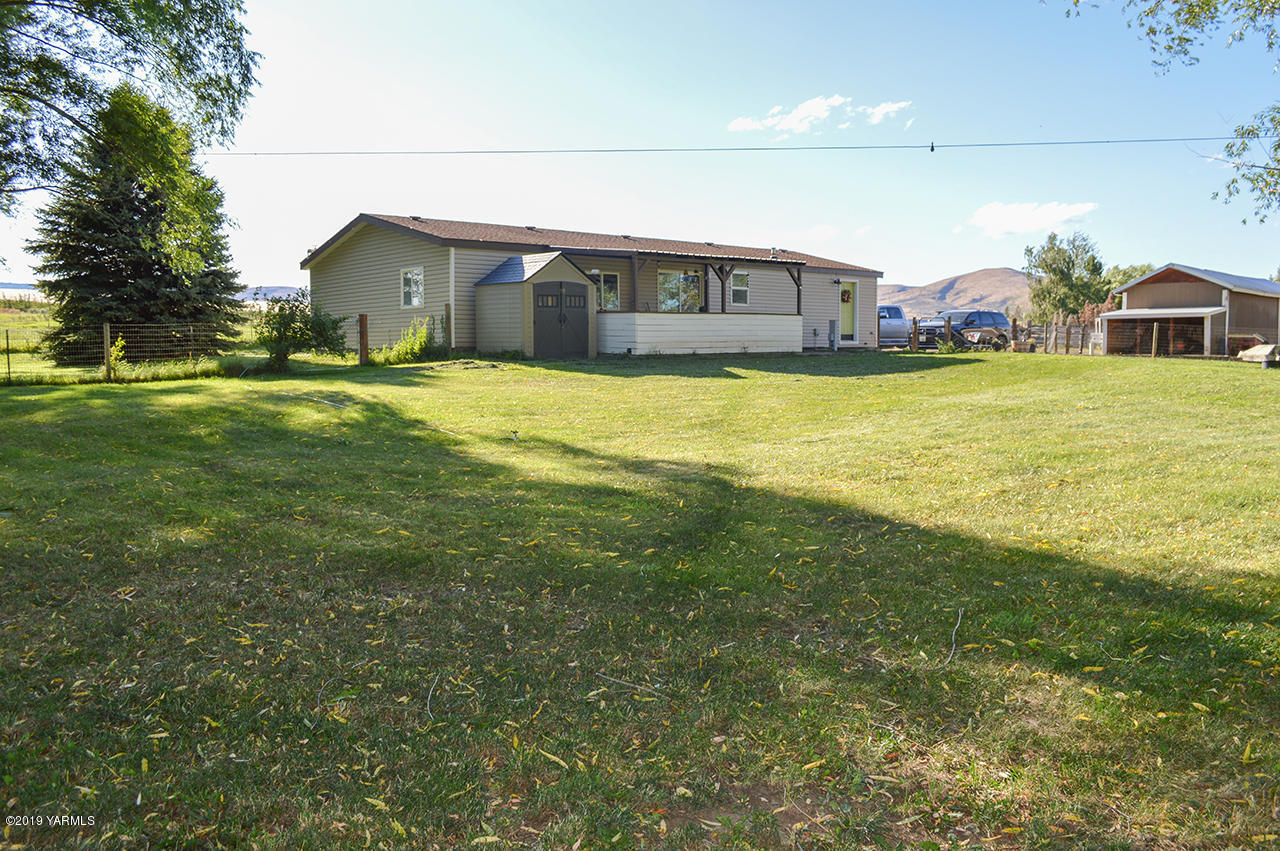 513 Burnham Road Yakima, WA 98908 - Photo 15 of 18 a front view of house with outdoor space and swimming pool