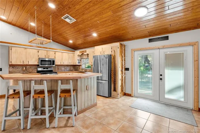 a view of a livingroom with furniture and a kitchen