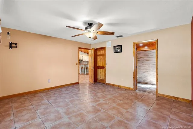 a view of a house with swimming pool and sitting area