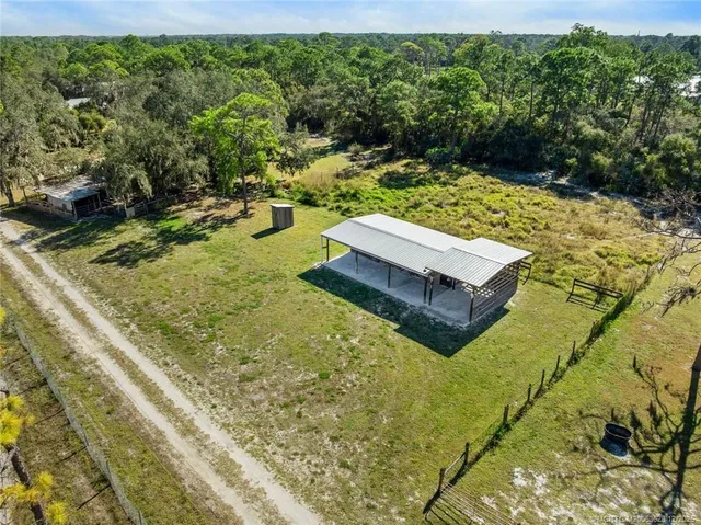 a view of a swimming pool with a yard