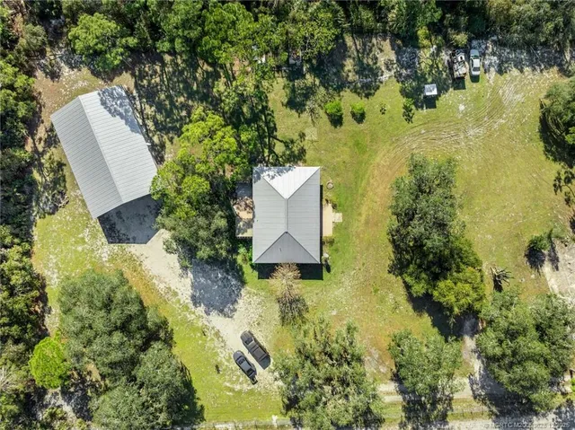 a large building with trees in front of it