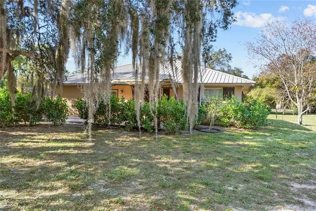a view of a yard with swimming pool