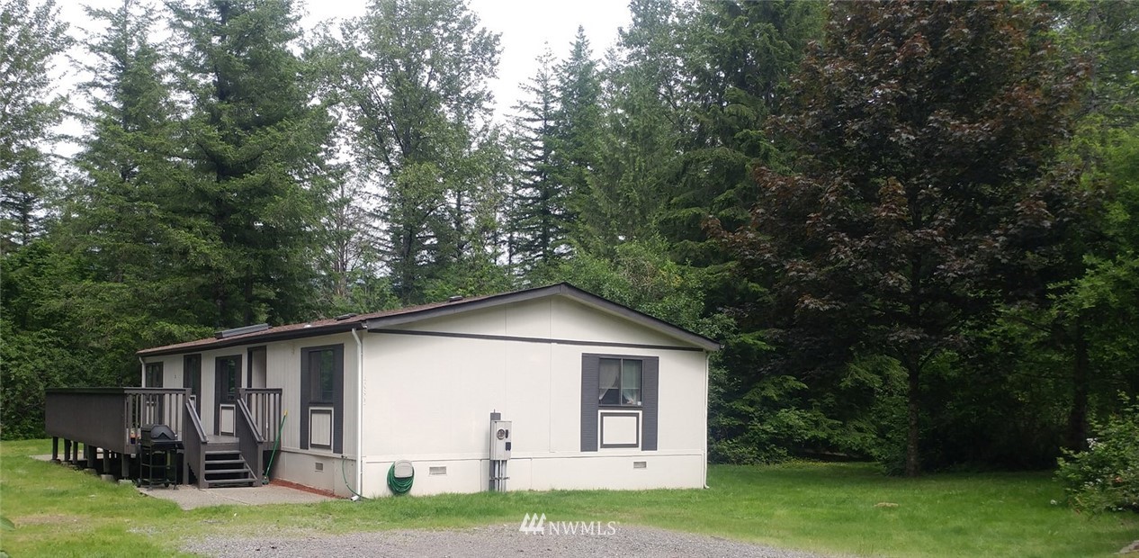 40805 Dorman Road Gold Bar, WA 98251 - Photo 1 of 25 a view of a house with backyard and garden