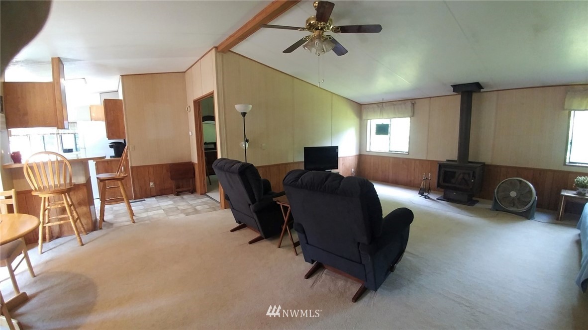 40805 Dorman Road Gold Bar, WA 98251 - Photo 5 of 25 a living room with furniture and a flat screen tv