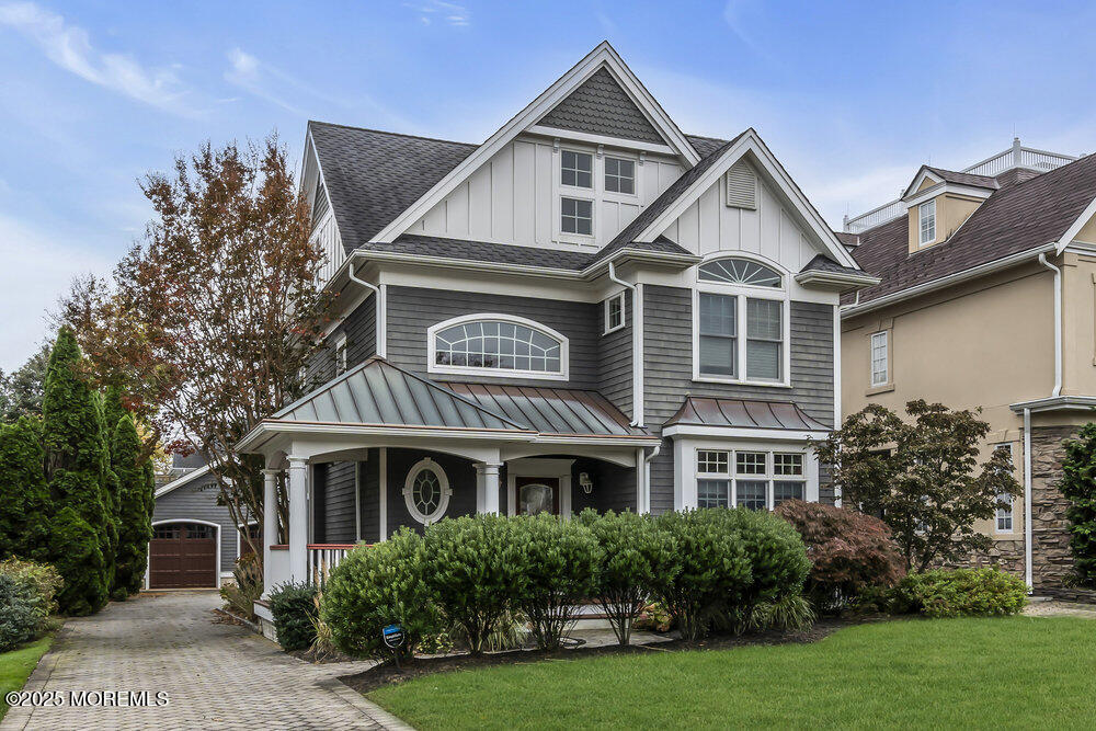 412 Chicago Boulevard Sea Girt, NJ 08750 - Photo 2 of 47 a front view of a house with a yard