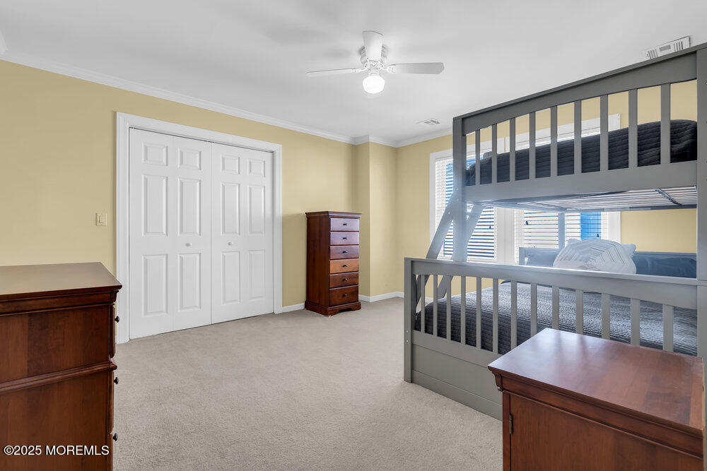 412 Chicago Boulevard Sea Girt, NJ 08750 - Photo 24 of 47 a living room with furniture and a baby crib