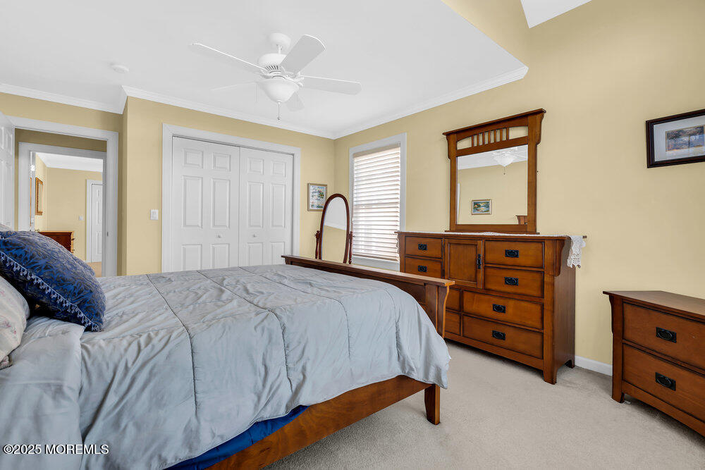 412 Chicago Boulevard Sea Girt, NJ 08750 - Photo 26 of 47 a bedroom with a bed and a dresser